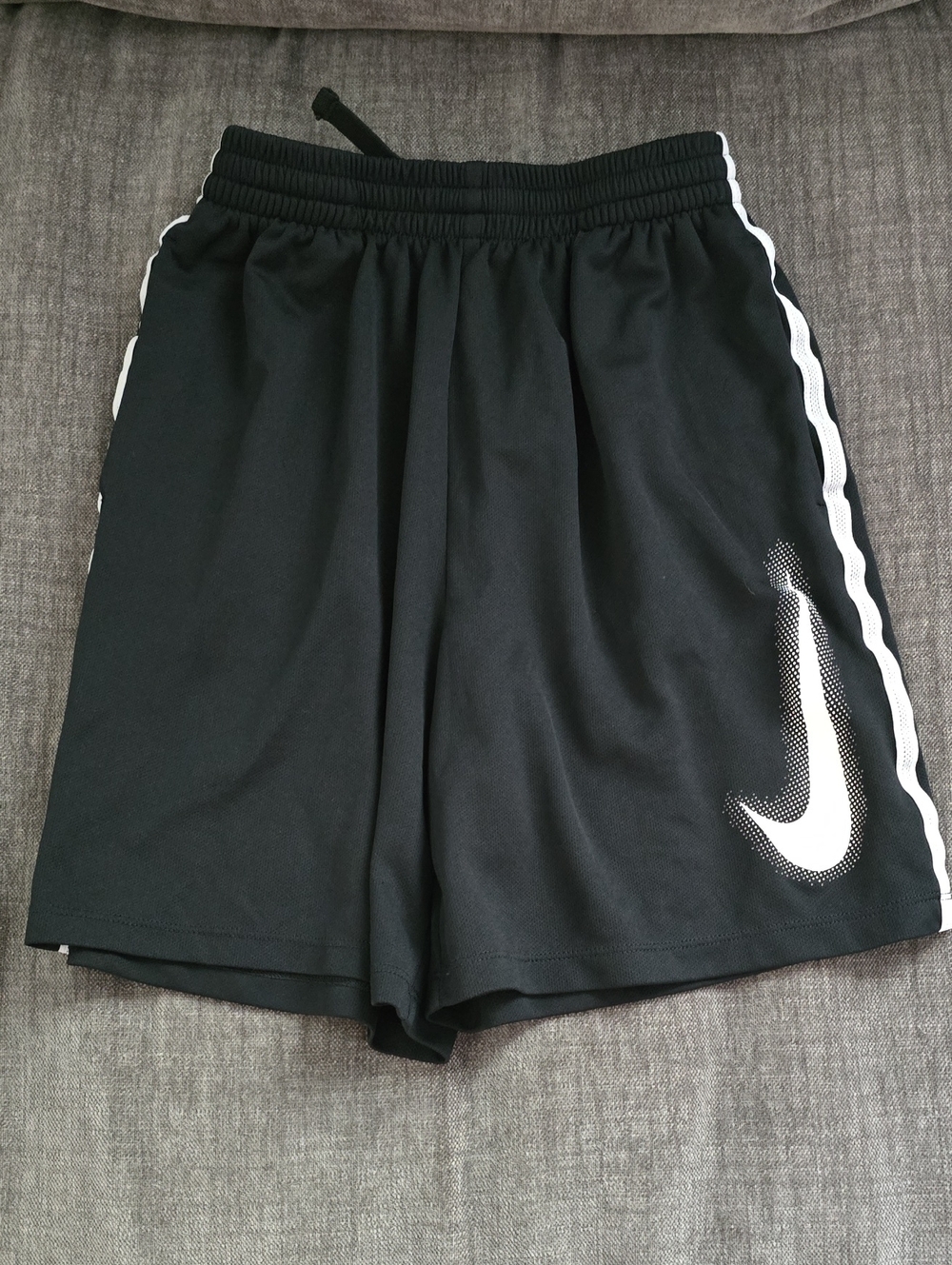 Nike Boy's Black Athletic Shorts with White Swoosh and Side Stripes